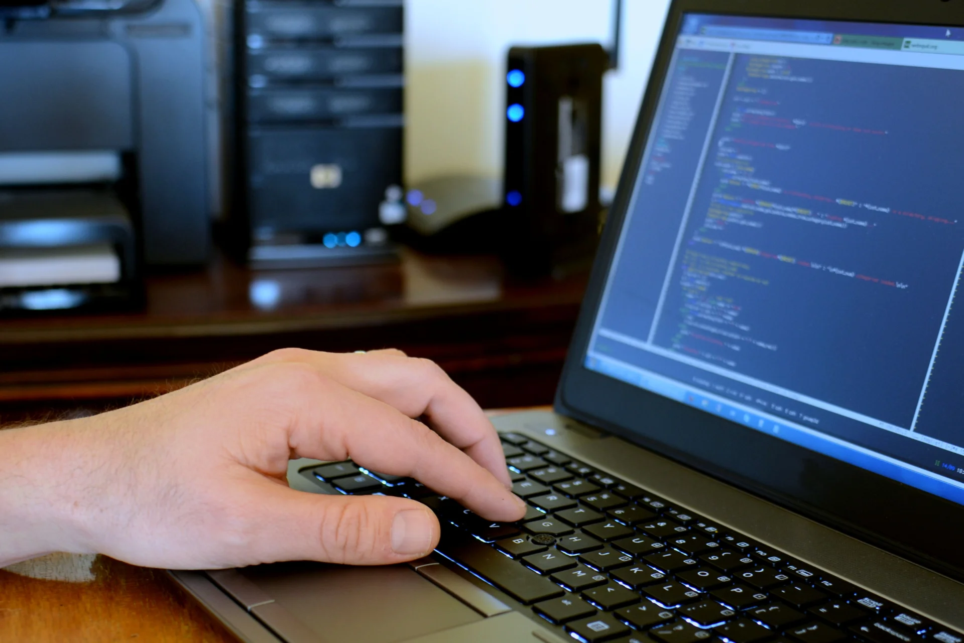 A person is coding for a custom enterprise level software as requiered by the client